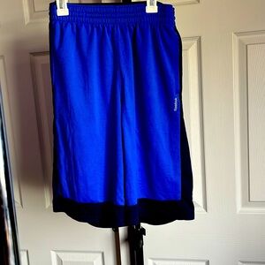 Small Reebok blue sport shorts.